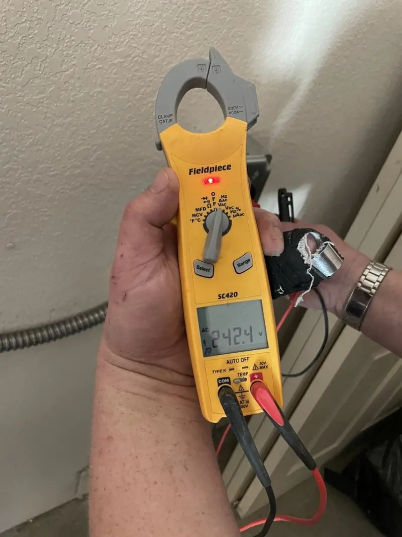 Voltage testing with clamp meter during Generator Installation in Rice Lake